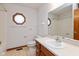 Bathroom features a large mirror, single sink vanity, and a tub and shower combination at 897 N Scott Dr, Greenwood, IN 46142