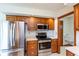 Updated kitchen featuring stainless steel appliances, light countertops, and wood cabinets at 897 N Scott Dr, Greenwood, IN 46142