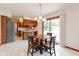 Bright eat-in kitchen featuring wood cabinets and access to the backyard via sliding glass doors at 897 N Scott Dr, Greenwood, IN 46142