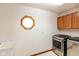 Laundry room featuring modern washer and dryer, sink and cabinet at 897 N Scott Dr, Greenwood, IN 46142