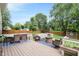 Inviting back deck with outdoor seating, dining area, and backyard views at 9832 Scotch Pine Ln, Indianapolis, IN 46256