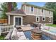 Inviting back deck with outdoor seating, dining area, and backyard views at 9832 Scotch Pine Ln, Indianapolis, IN 46256