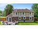 Back exterior showcasing the back deck, brick chimney and backyard at 9832 Scotch Pine Ln, Indianapolis, IN 46256