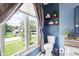 Bathroom with a window, neutral colors, and a classic toilet creates a functional and serene space at 9832 Scotch Pine Ln, Indianapolis, IN 46256