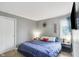 Inviting bedroom with a cozy bed, bedside tables, and soft carpet, creating a relaxing ambiance at 9832 Scotch Pine Ln, Indianapolis, IN 46256