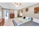 Expansive bedroom featuring dual beds, stylish decor, and soft natural light creates a serene and comfortable space at 9832 Scotch Pine Ln, Indianapolis, IN 46256