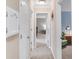 Hallway featuring interior door with views into adjacent rooms of the home at 9832 Scotch Pine Ln, Indianapolis, IN 46256