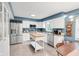 Bright kitchen with stainless steel appliances, white cabinetry, and butcher block island at 9832 Scotch Pine Ln, Indianapolis, IN 46256