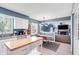 Open-concept kitchen with white cabinets, an island, a dining area, and a seamless transition to the adjoining Gathering room at 9832 Scotch Pine Ln, Indianapolis, IN 46256