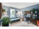Inviting home office featuring blue walls and a stylish desk with ample natural light at 9832 Scotch Pine Ln, Indianapolis, IN 46256