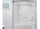 Clean shower and tub combination with white tile and shower curtain at 9832 Scotch Pine Ln, Indianapolis, IN 46256