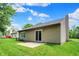 Well-maintained backyard featuring a patio and siding, backing up to the adjacent home at 10412 Cedar Dr, Fishers, IN 46037