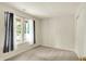 Neutral-toned bedroom featuring a window and light-colored walls at 10412 Cedar Dr, Fishers, IN 46037