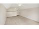 Large bonus room with dormered ceilings and a ceiling fan and carpeted floors at 10412 Cedar Dr, Fishers, IN 46037