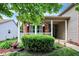 Cozy front porch with hanging plants, brick accents, and a well-maintained garden at 10412 Cedar Dr, Fishers, IN 46037