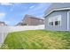A well-manicured lawn bordered by a privacy fence adds to the appeal of the backyard at 10419 Pronghorn Ln, Indianapolis, IN 46239