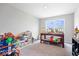 Spacious carpeted bonus room features a large window and ample area for activities at 10419 Pronghorn Ln, Indianapolis, IN 46239