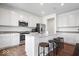 Modern kitchen with stainless steel appliances, granite countertops, white cabinets, and a center island with seating at 10419 Pronghorn Ln, Indianapolis, IN 46239