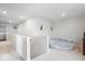 Upstairs loft area with a beanbag chair and neutral colored walls and flooring at 10419 Pronghorn Ln, Indianapolis, IN 46239