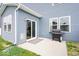 Backyard patio featuring blue siding, a sliding glass door and a grill at 10419 Pronghorn Ln, Indianapolis, IN 46239