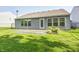 Backyard with stone patio and vinyl siding at 10763 Zimmerman Ln, Indianapolis, IN 46231
