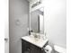 Cozy bathroom featuring a single sink vanity and neutral color palette at 10763 Zimmerman Ln, Indianapolis, IN 46231