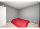 Simple bedroom with neutral colored walls and carpet and a single window at 10763 Zimmerman Ln, Indianapolis, IN 46231