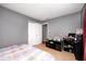 Bedroom has wood-look flooring, closet and furniture at 10763 Zimmerman Ln, Indianapolis, IN 46231