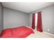 Simple bedroom with neutral colored walls and carpet and a single window at 10763 Zimmerman Ln, Indianapolis, IN 46231