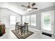 Dining area boasts neutral tones, decorative lighting, and a view to the backyard at 10763 Zimmerman Ln, Indianapolis, IN 46231