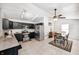 Modern eat in kitchen featuring stainless steel appliances and dark cabinetry with tiled flooring at 10763 Zimmerman Ln, Indianapolis, IN 46231