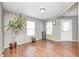 Bright living room featuring hardwood floors, neutral paint, and lots of natural light at 10763 Zimmerman Ln, Indianapolis, IN 46231