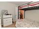 Cozy bedroom with a bunk bed featuring a comfortable space for a , dresser with personal belongings at 122 E 27Th St, Indianapolis, IN 46205