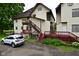Backyard view of home featuring an exterior staircase and parking at 122 E 27Th St, Indianapolis, IN 46205