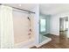 Bathroom includes a glass shower, a shower-tub combo and hardwood flooring at 12612 Majestic Way, Fishers, IN 46037