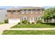 Charming brick home with an attached two-car garage and a lush green lawn with manicured bushes at 12612 Majestic Way, Fishers, IN 46037