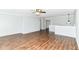 Bright, open-concept living area with hardwood floors and easy access to adjacent rooms at 12612 Majestic Way, Fishers, IN 46037