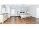 This primary suite offers ample natural light and hardwood flooring at 12612 Majestic Way, Fishers, IN 46037