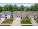 Beautiful aerial view of a two-story home showcasing a large lawn, mature trees, and neighborhood at 1274 Timber Bluff Rd, Westfield, IN 46074
