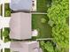 Birds-eye view of a home featuring a well-kept lawn, patio, and fencing, surrounded by lush trees at 1274 Timber Bluff Rd, Westfield, IN 46074