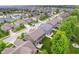 Aerial view featuring the home and surrounding neighborhood with mature trees and a community lake at 1274 Timber Bluff Rd, Westfield, IN 46074