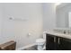 Half bathroom with a granite countertop, dark wood cabinet, and neutral decor at 1274 Timber Bluff Rd, Westfield, IN 46074