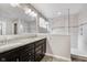 Bathroom features a double vanity with granite countertops, a large mirror, and a glass-enclosed shower at 1274 Timber Bluff Rd, Westfield, IN 46074