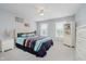 Bedroom with natural light, neutral walls, two windows, and a colorful comforter set at 1274 Timber Bluff Rd, Westfield, IN 46074