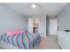 Bright bedroom features a closet, ceiling fan, and a colorful striped bedspread at 1274 Timber Bluff Rd, Westfield, IN 46074