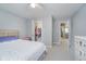 Bedroom features a closet, ceiling fan, and a bed with a star patterned comforter at 1274 Timber Bluff Rd, Westfield, IN 46074