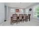 Dining room with carpeted floor, soft lighting, and ample natural light from two windows at 1274 Timber Bluff Rd, Westfield, IN 46074