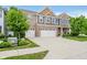 Two-story home with brick and siding, complemented by a well-maintained lawn and a spacious driveway at 1274 Timber Bluff Rd, Westfield, IN 46074