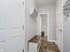 Functional hallway with storage, a bench, and access to additional rooms and closet space at 1274 Timber Bluff Rd, Westfield, IN 46074
