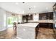 Spacious kitchen features a large center island, modern appliances, granite countertops, and dark wood cabinets at 1274 Timber Bluff Rd, Westfield, IN 46074